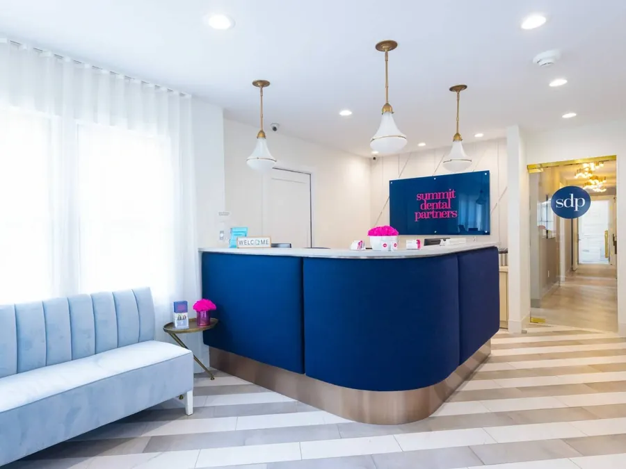 The reception desk and waiting area inside Summit Dental Partners.